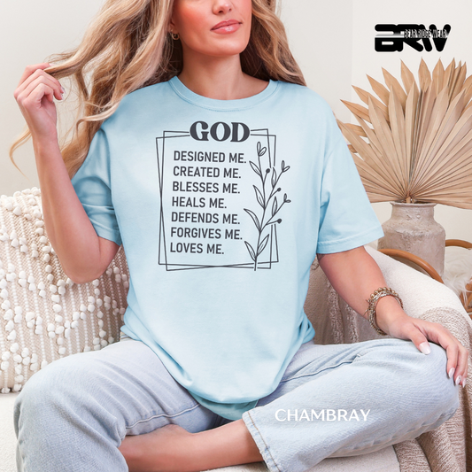 Woman wearing a light blue t-shirt with a motivational quote, sitting in a cozy room. FAITH TEE