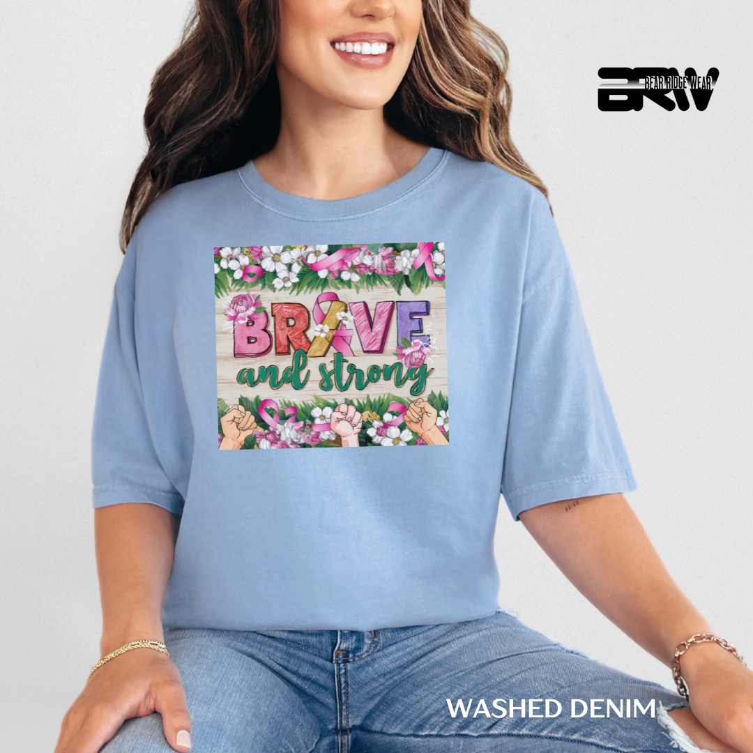Woman wearing a blue t-shirt with 'Brave and strong' design and 'Washed Denim' text.